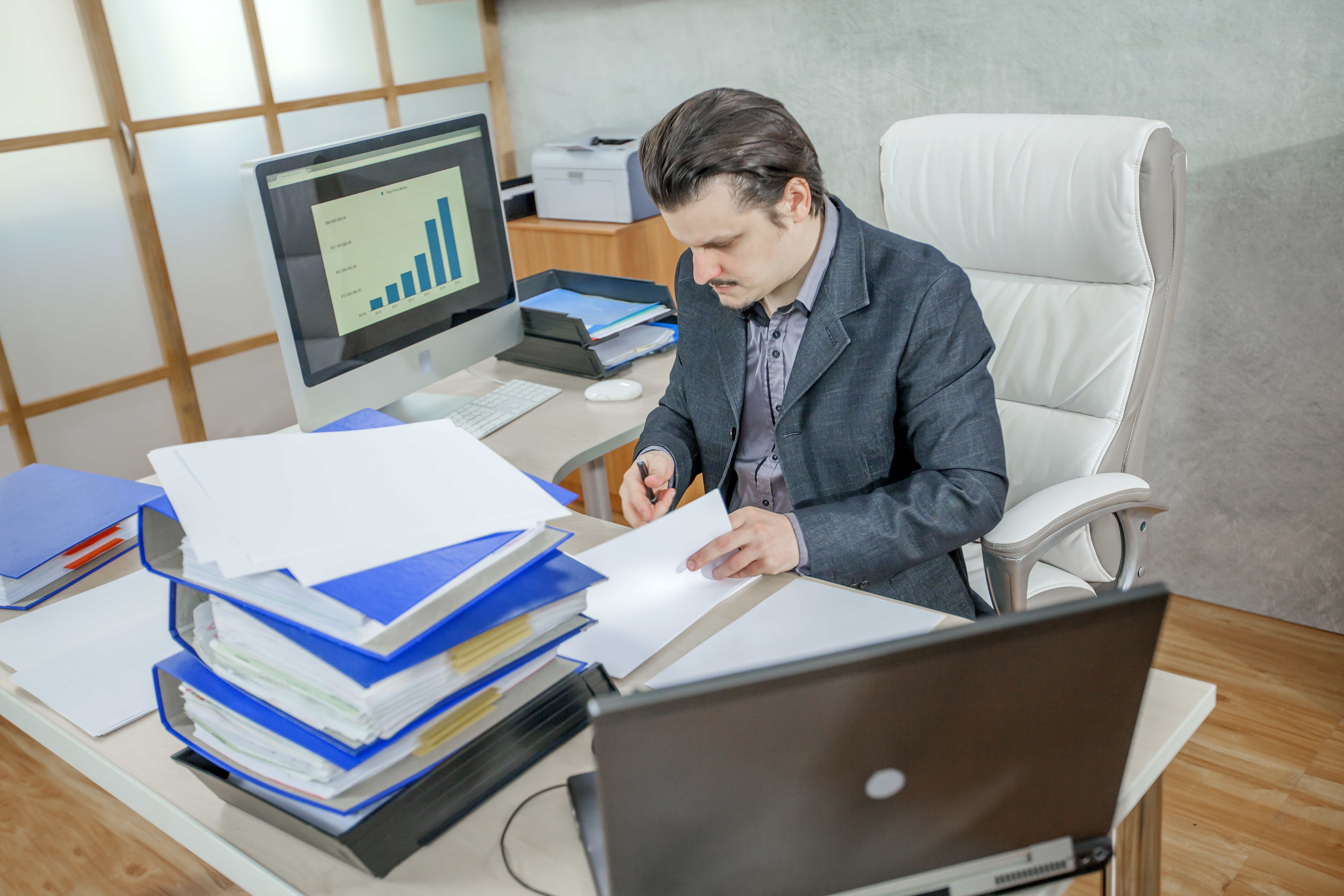 young-businessman-working-from-his-office-concept-hard-work.jpg